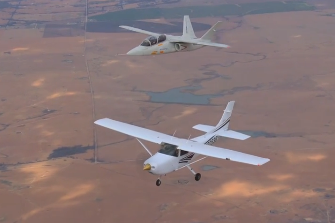 Scorpion shows off its low speed handling characteristics during a mock interception of a Cessna 182 flying at 120 KCAS