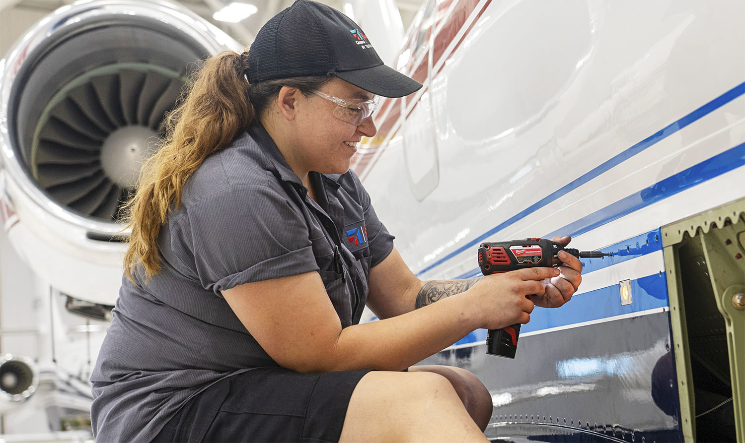 Aircraft mechanic working on the airframe.