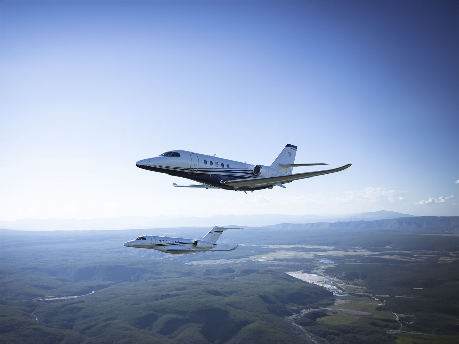 Cessna Citation Longitude and Cessna Citation Latitude in the air.