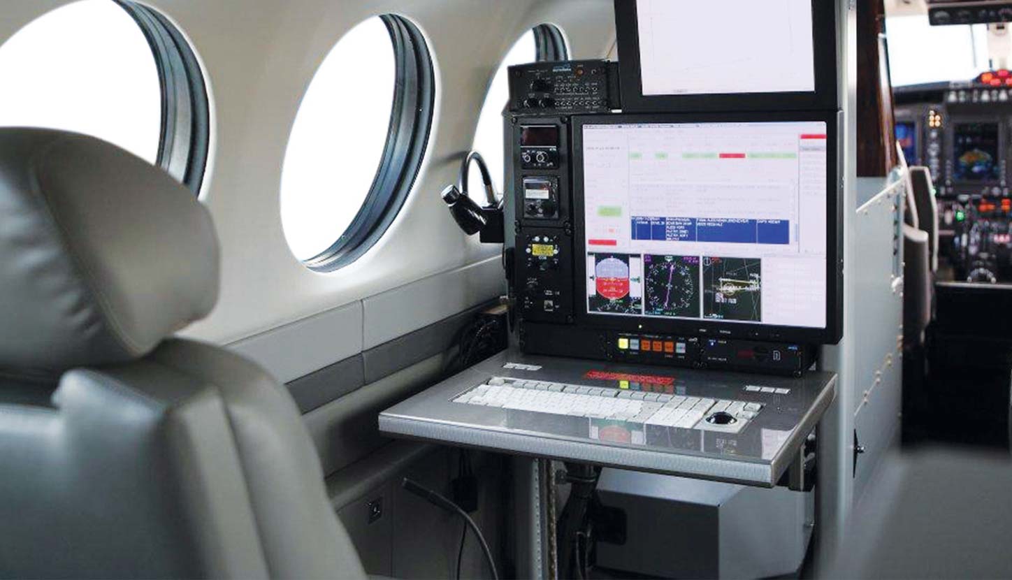 The cabin interior of an aircraft equipped for a flight inspection mission.”
